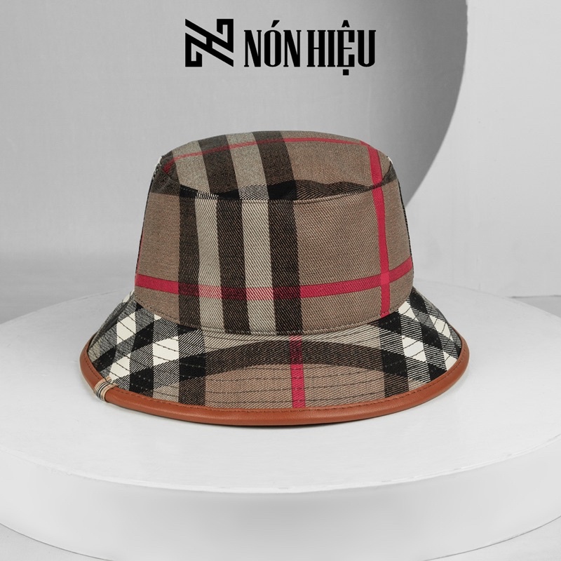 Mũ lưỡi trai - Nón Bucket phối viền da hoạ tiết Burberry MADE IN BANGLADESH Full Tem Mark hãng