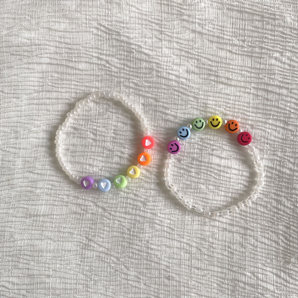 Vòng tay handmade trắng pastel mix hạt charm