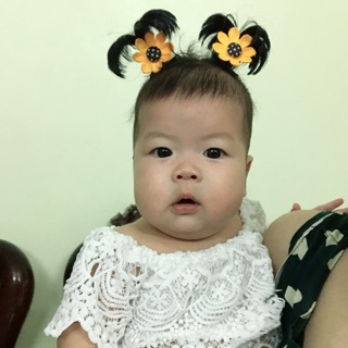Kẹp tóc cột cây dừa cho bé