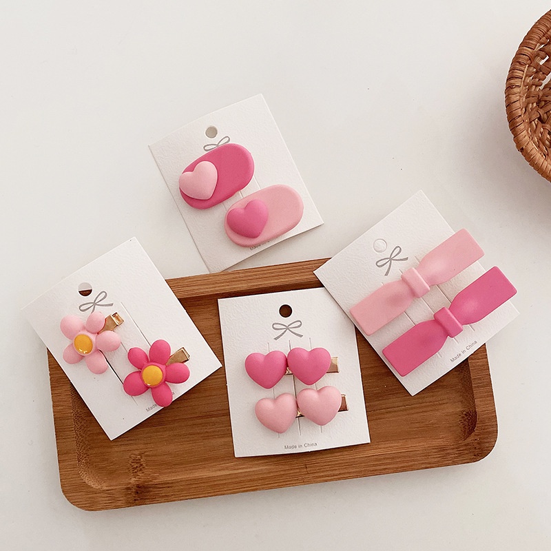 Kẹp tóc tông hồng trái tim cực cute