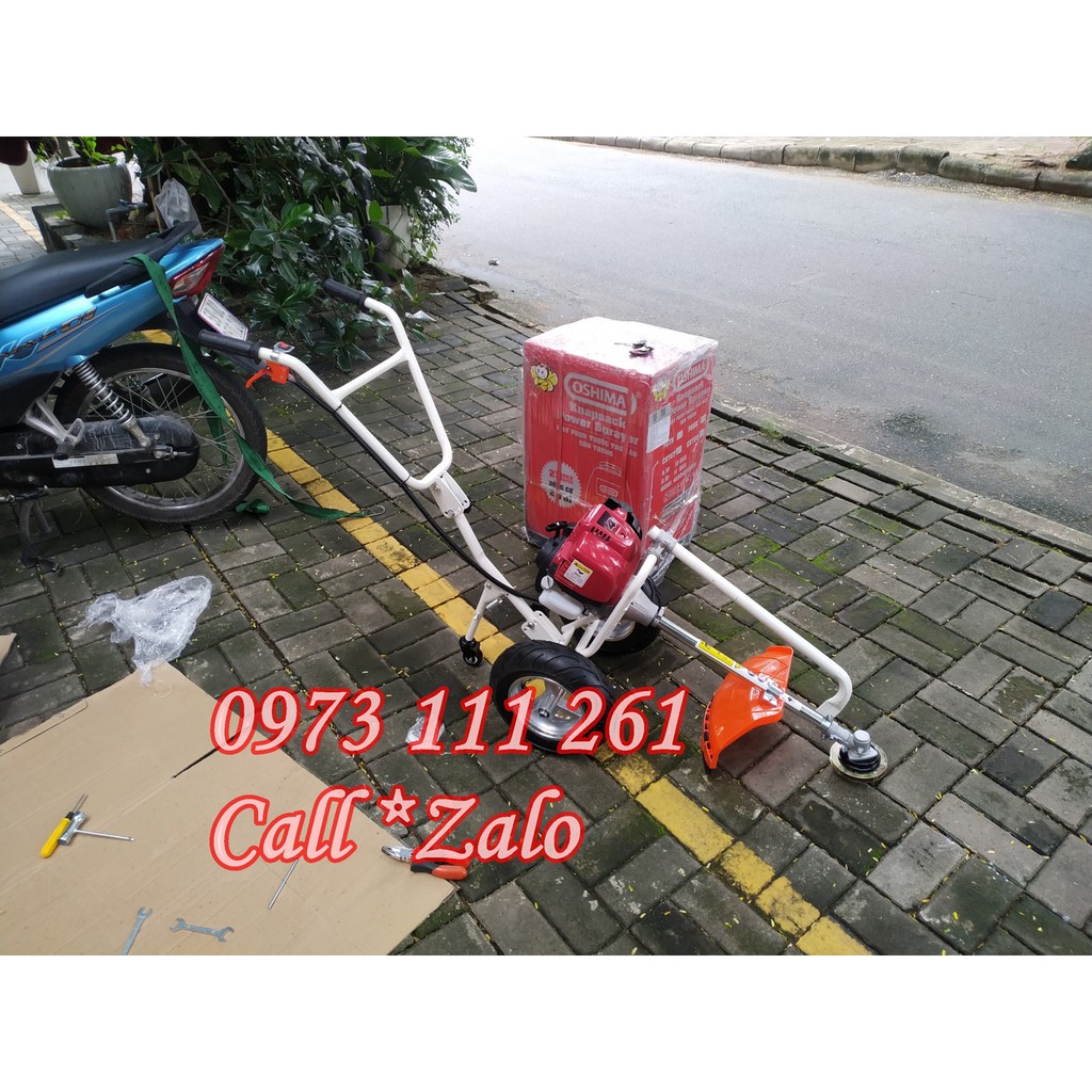 Máy cắt cỏ đẩy tay động cơ 2 thì (khung + động cơ 2 thì, đầu cắt cỏ, lưỡi cắt) có trục chuyển đổi thành xới đất