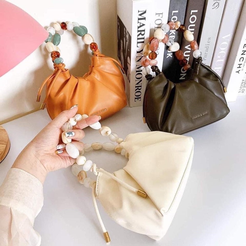 Túi cnk tay cầm đá đeo chéo