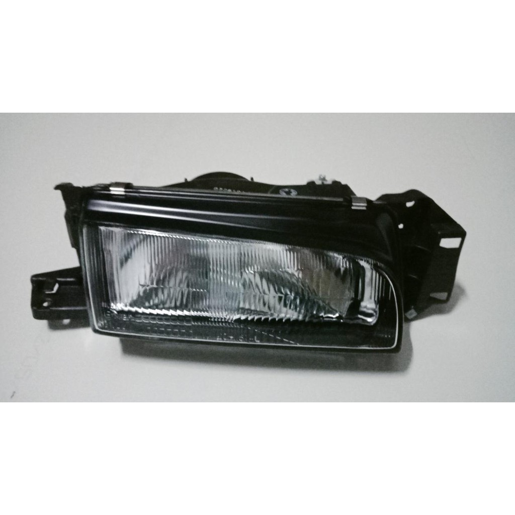 Đèn pha Mazda 323 đời 1995-1997 -tặng vòng xoay hương hoa