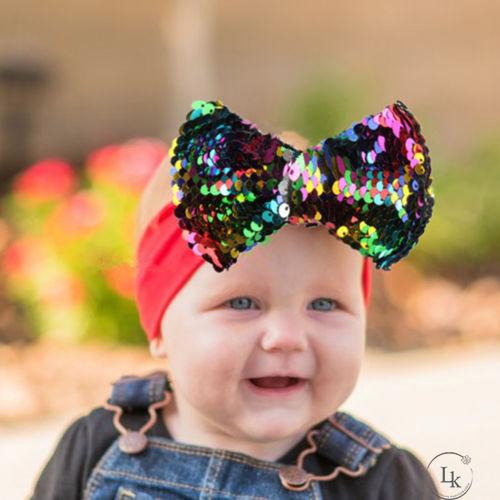 Băng đô co dãn đính nơ sequins xinh xắn cho bé gái