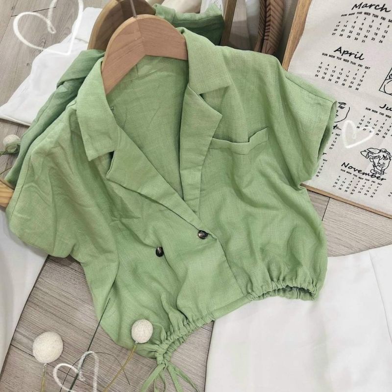 Set áo xanh cổ vest rút dây + chân váy trắng xẻ.