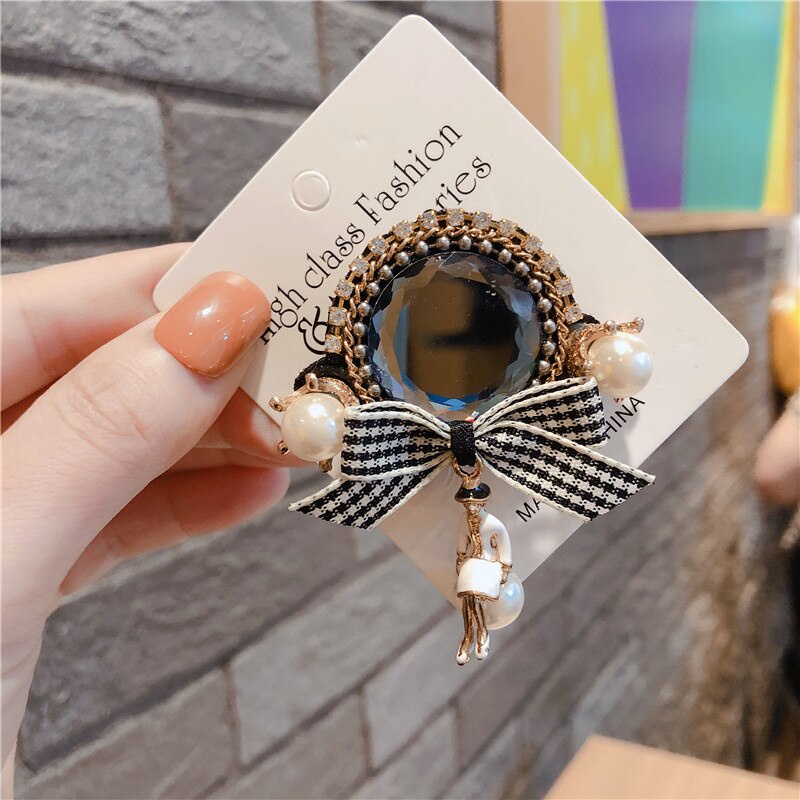 Trâm cài áo hình nơ đính ngọc trai sang trọng