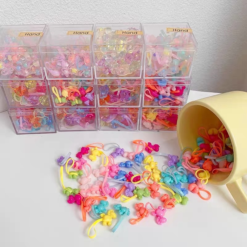 Hạt charm xỏ chun cột tóc cho bé