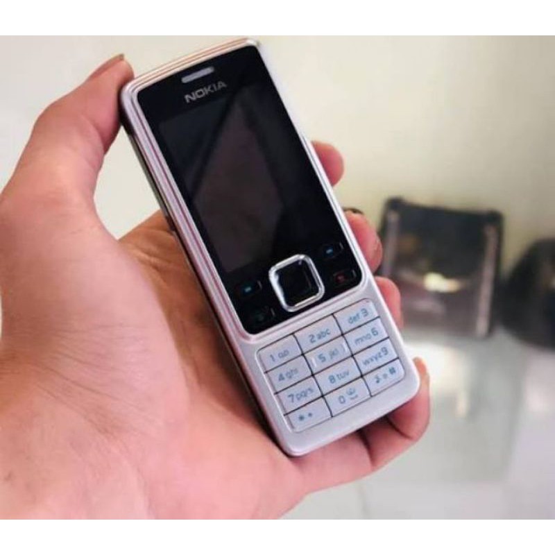 Điện thoại Nokia 6300 đầy đủ pin sạc màu bạc