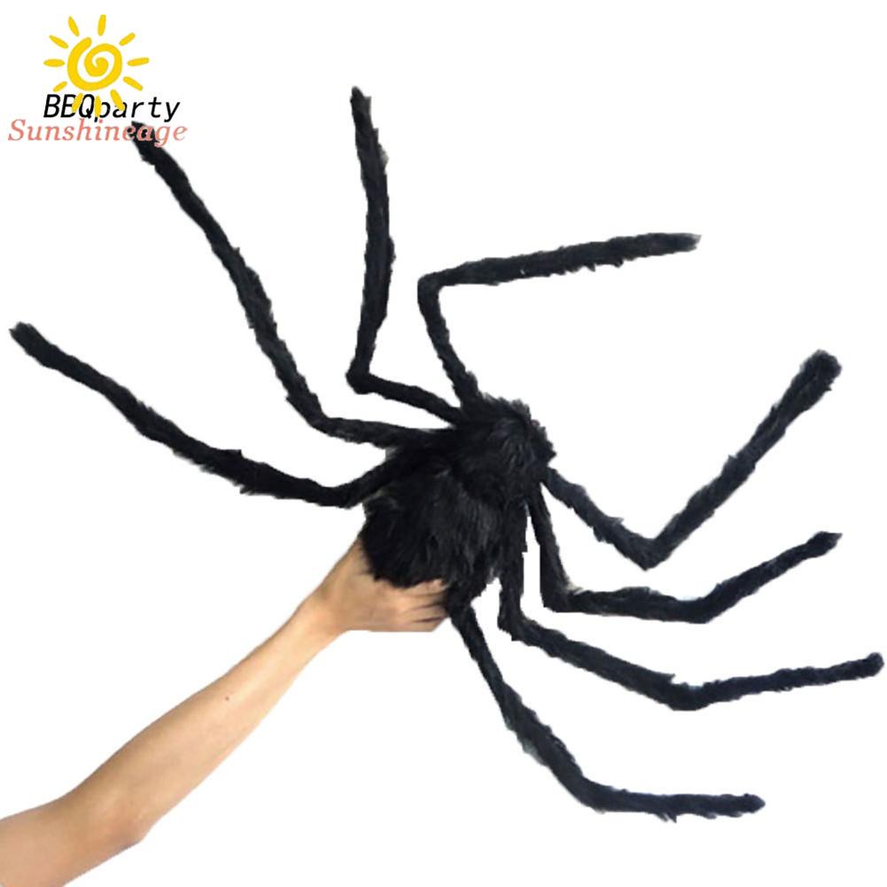Halloween giant spiders hang in haunted homes, decorated with black fake spiders, cunning toys and Halloween gifts