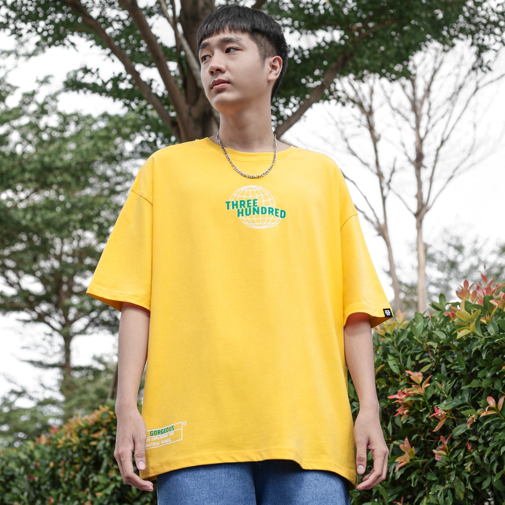 Áo Thun Vàng In Chữ The World Gorgeous Màu Xanh Chất Liệu 100% Cotton Form Rộng Thoải Mái Unisex Nam Nữ