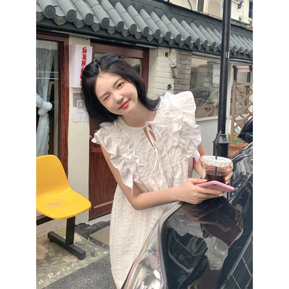 Váy trắng xoè ngắn babydoll điệi đà, phối bèo vai cánh tiên xinh xắn đáng yêu
