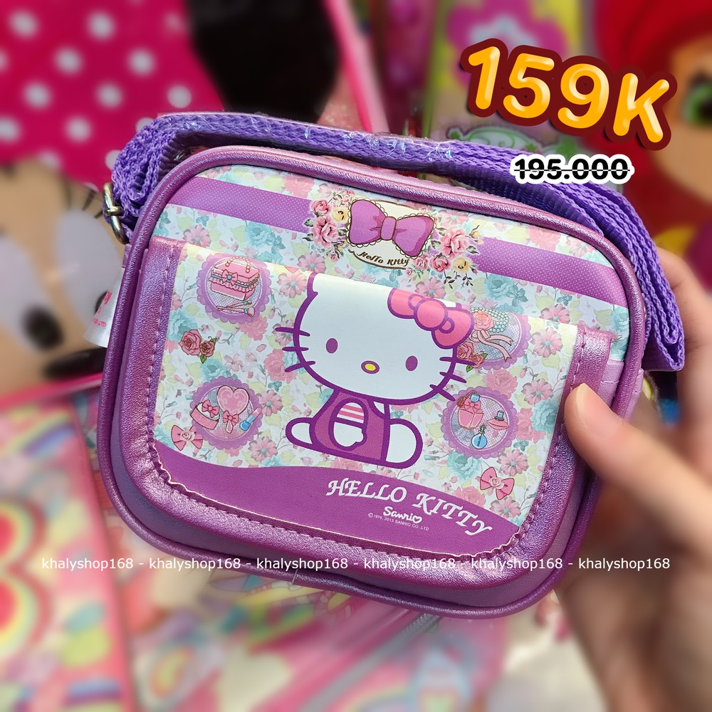 Túi đeo chéo hình mèo Hello Kitty nhiều hoa nơ  2 ngăn màu tím trắng cho bé gái (Thái Lan) - 2505KT02502 - (11x4x13cm)