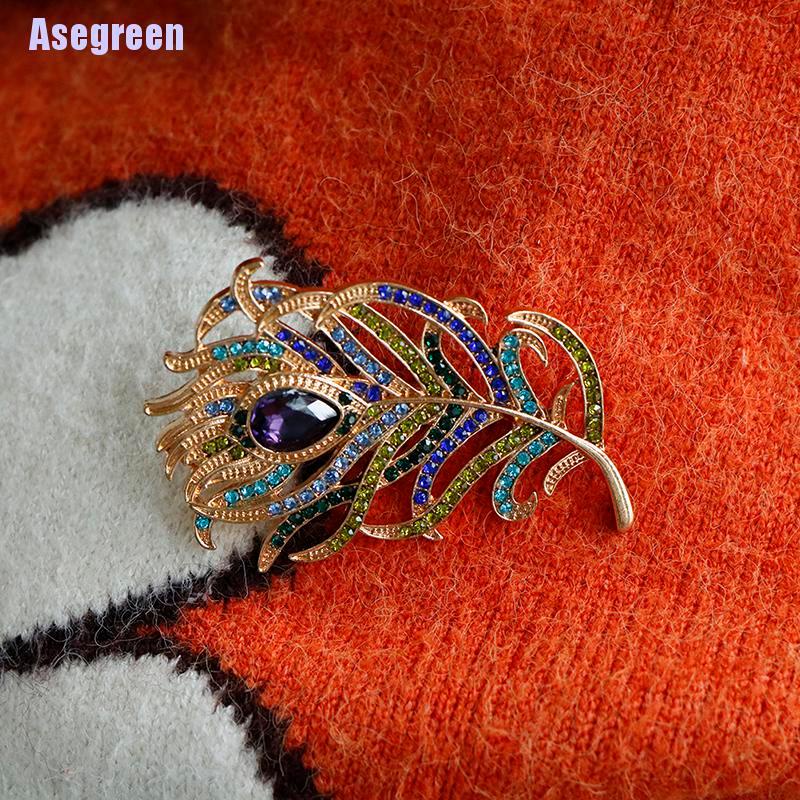 Ghim cài áo hình lông công đính đá pha lê sang trọng