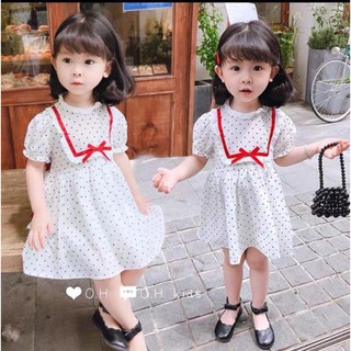 Xả Váy trắng chấm bi nơ đỏ cho bé gái