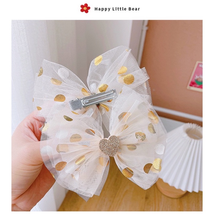 Kẹp tóc nơ tone vàng xinh xắn cho bé