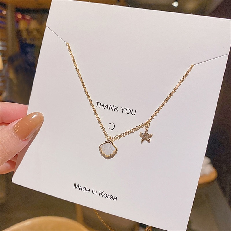 Dây chuyền thép titan mặt sao biển vỏ sò phát quang phong cách Nhật Hàn cho nữ