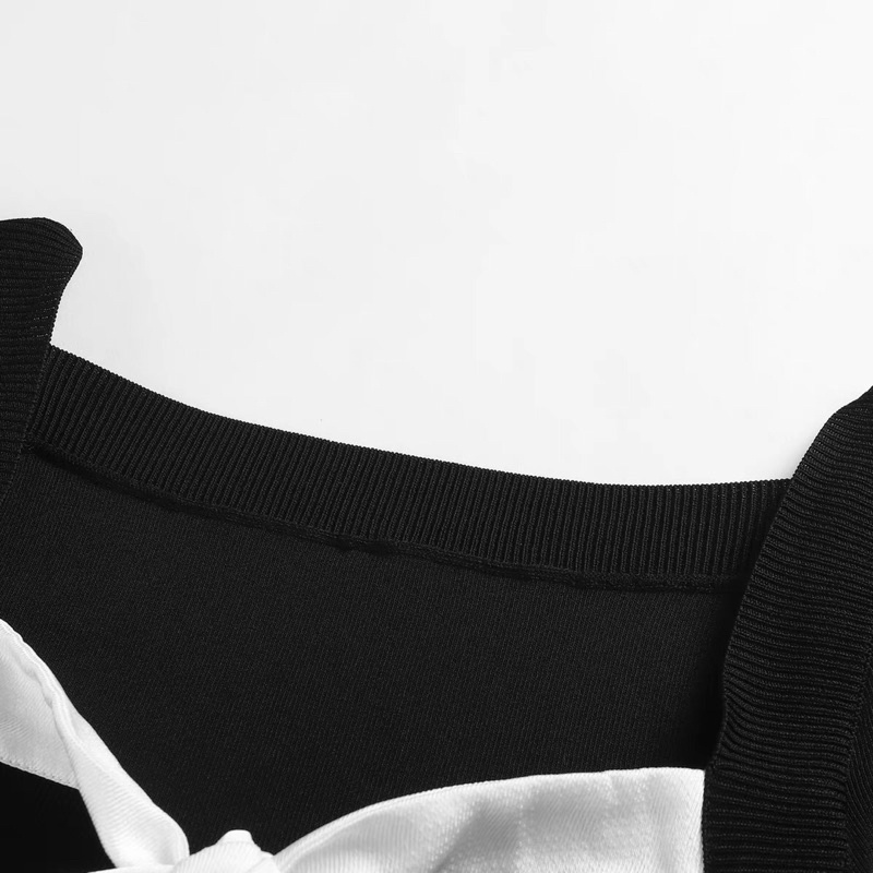 Áo len đen phối nơ trắng Peacebird