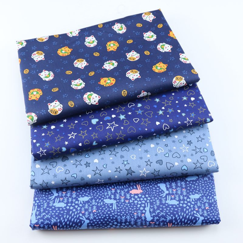 Vải 100% cotton họa tiết hoạt hình màu xanh dương dùng may vá thủ công
