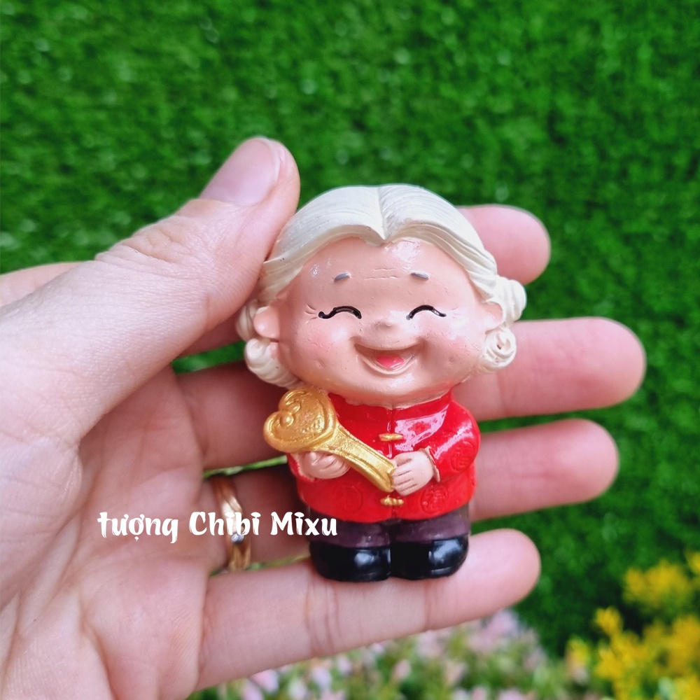 Bộ 02 tượng Bách Niên Giai Lão size nhí (ông bà áo đỏ) kèm chậu đào trường thọ