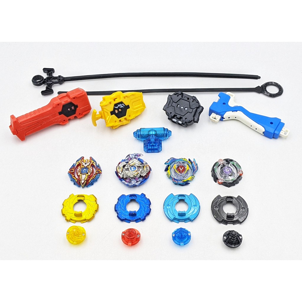 Bộ 4 Con quay BeyBlade + 3 Tay phóng + Sàn đấu - Con quay vòng xoay thần tốc