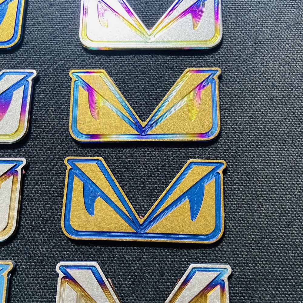 TEM trang trí xe máy HOẠT HÌNH MẮT CÚ chất liệu TITANNIUM