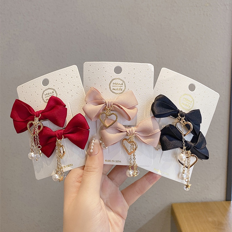 ✨✨Set 2 Kẹp Tóc Nơ Tua Rua Đính Ngọc Trai Giả Mừng Năm Mới