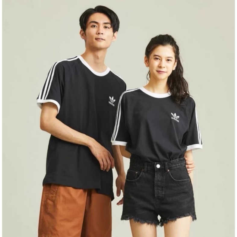 Bộ quần áo Adidas kẻ sọc