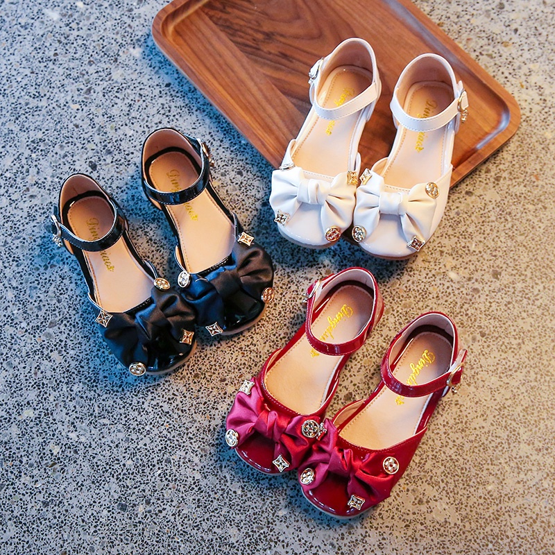 Xăng đan Da Đế Bằng Phối Nơ Thanh Lịch Cho Bé Gái 3-16 Tuổi