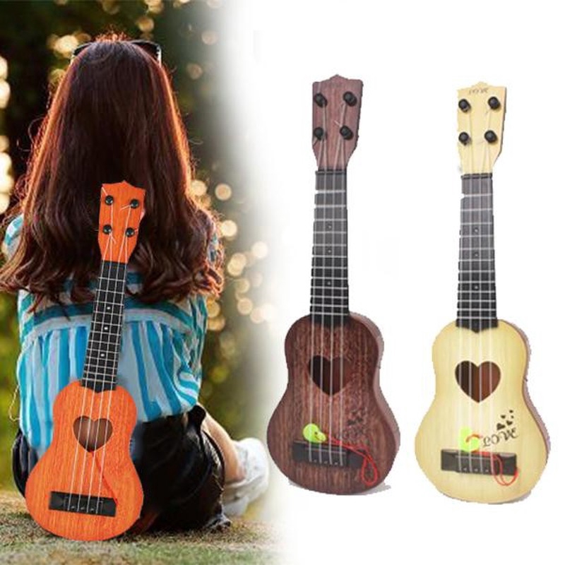 Đàn Ghi Ta Ukulele Mini Họa Tiết Trái Tim