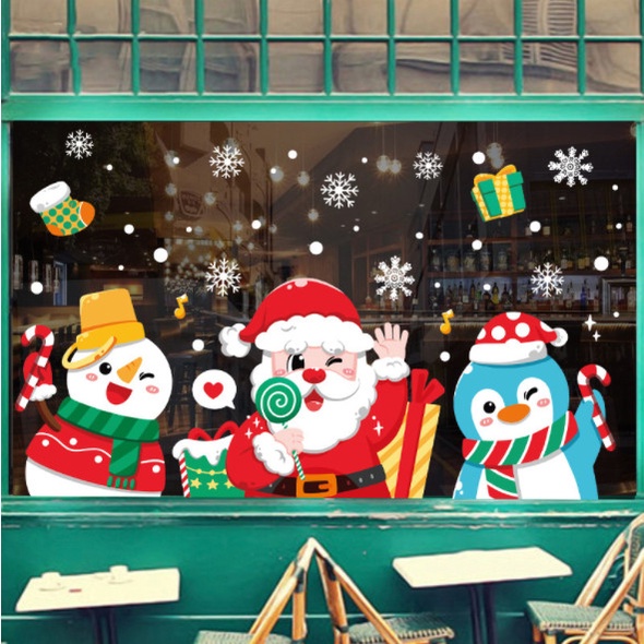 Decal dán tường Noel Hít Tĩnh Điện không Dơ Kính - Noel cầm kẹo đón giáng sinh