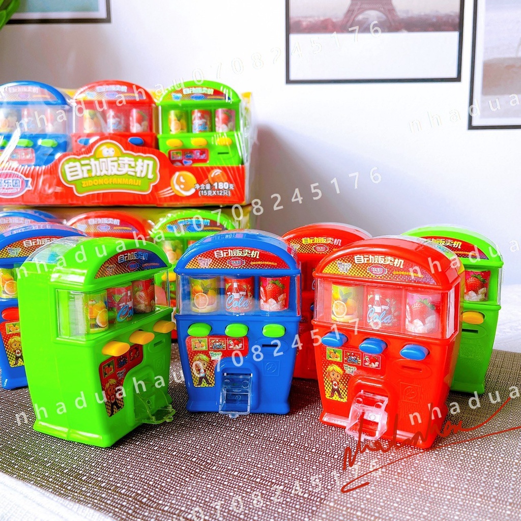 Máy bắn kẹo (có sẵn kẹo) hình máy bán hoa quả/ máy bán nước ngọt tự động Hongkong cái lớn 180gam