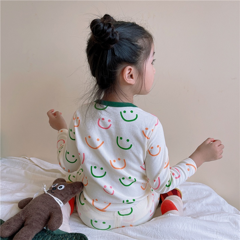 Bộ áo thun tay dài và quần dài in hình mặt cười cho trẻ sơ sinh