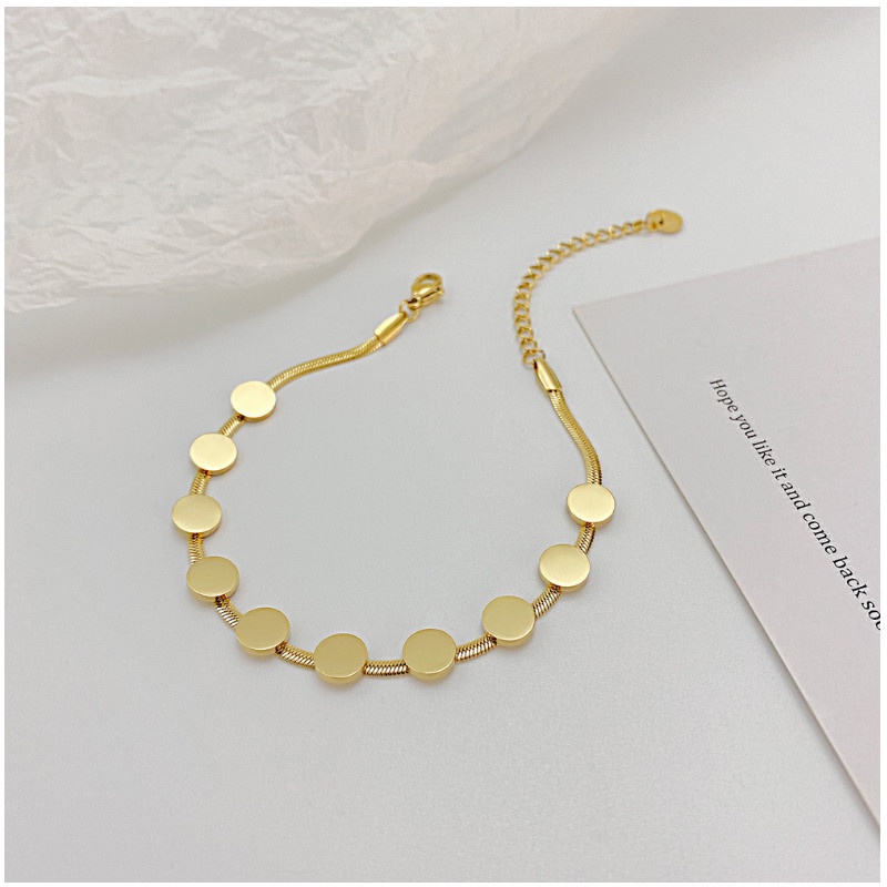 Lắc Tay Nữ Titan Ko Đen Dây Mì Dẹt Và Nhiều Hình Tròn Nhỏ TT 4068