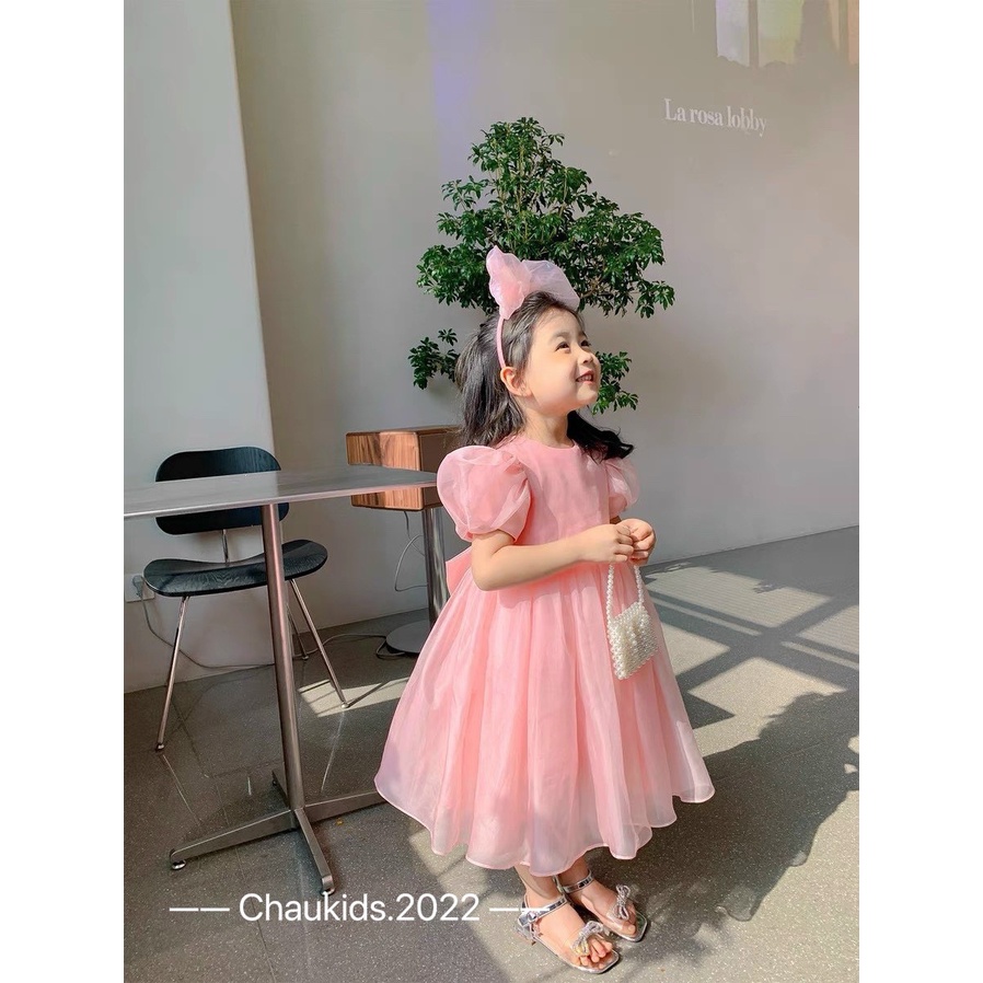Váy tơ hồng trơn nơ lưng bé gái