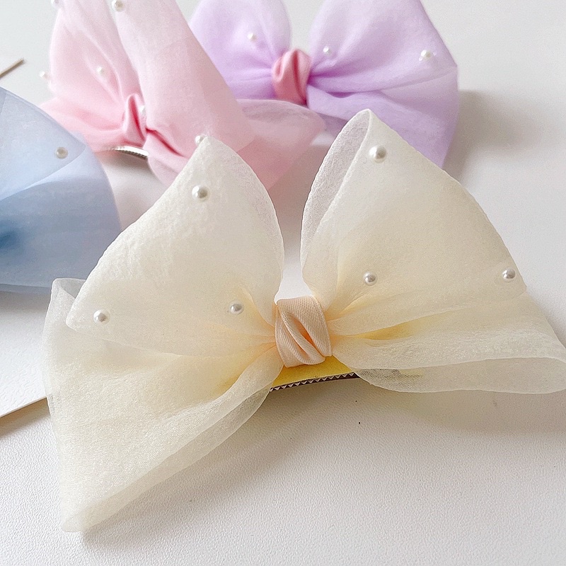 Nơ voan đính hạt dáng 3D màu pastel xinh xinh cho bé
