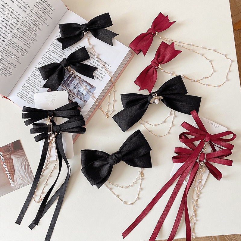 Kẹp tóc ruy băng màu đen thắt nơ phối tua rua thời trang dành cho nữ