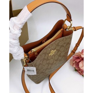 Túi Coach da thật pha canvas dáng ống màu mới