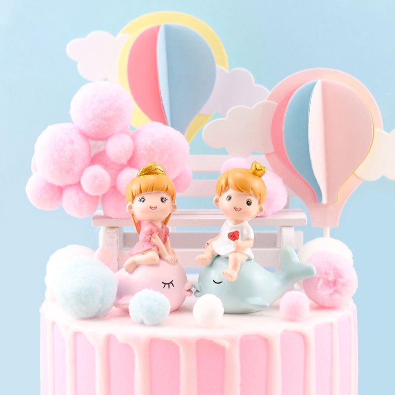 Trang trí bé trai cưỡi cá heo