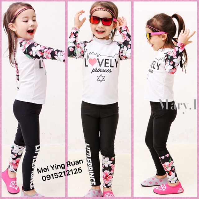 Bộ bơi dài tay hoa trắng và đen