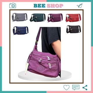 Túi đeo chéo 1 quai nữ Kipling 8011, chất vải trống nước, nhiều ngăn phụ chứa đồ, quai đeo bản to chắc chắn.