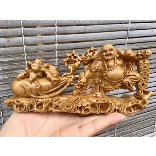 Tượng gỗ mỹ nghệ - di lặc kéo bao gỗ bach xanh