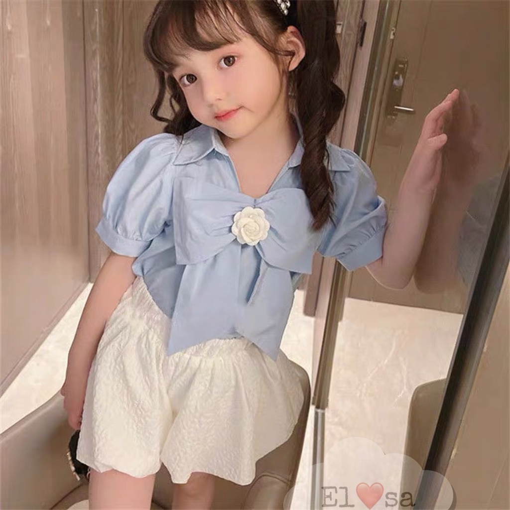 Set áo tay phồng kèm bông hoa + chân váy trắng phong cách HOTRENDS  annakids