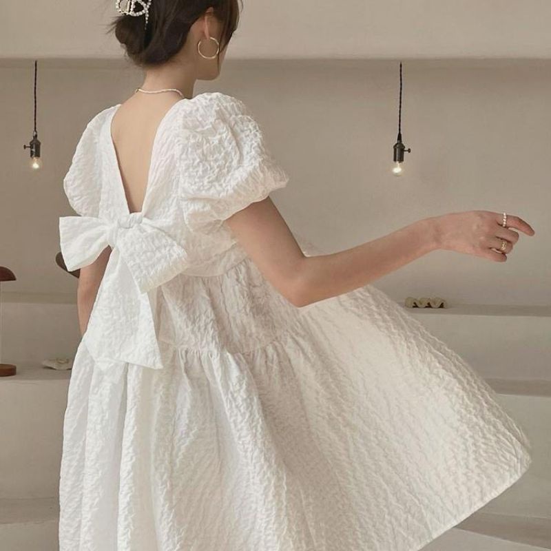 Váy đầm babydoll phồng thắt nơ hở lưng chất vải xốp
