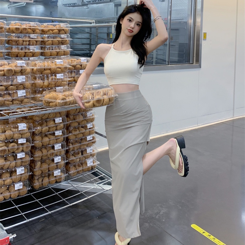 Set đồ COZOKC gồm chân váy xẻ tà lưng cao và áo không tay thời trang cho nữ