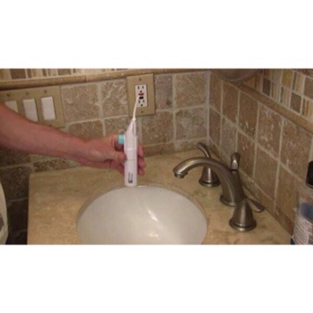 Máy xịt vệ sinh răng