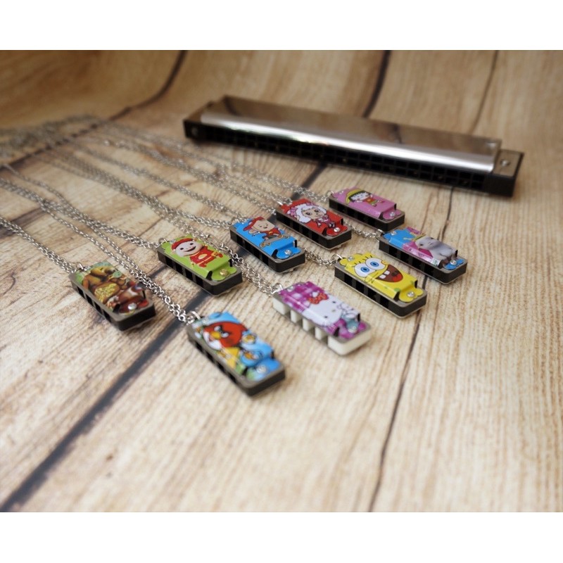 Kèn mini harmonica 4 lỗ hoạt hoạ dây chuyền