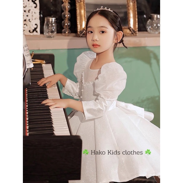 Váy trắng tay bồng đính ngọc hk bé gái