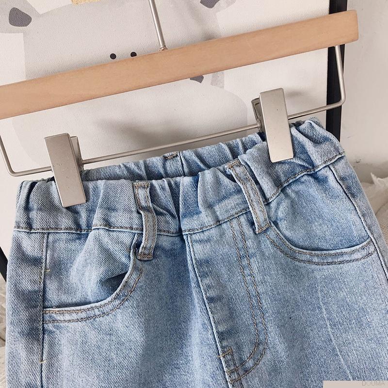 Quần jeans ống loe đính nơ thời trang cho bé gái