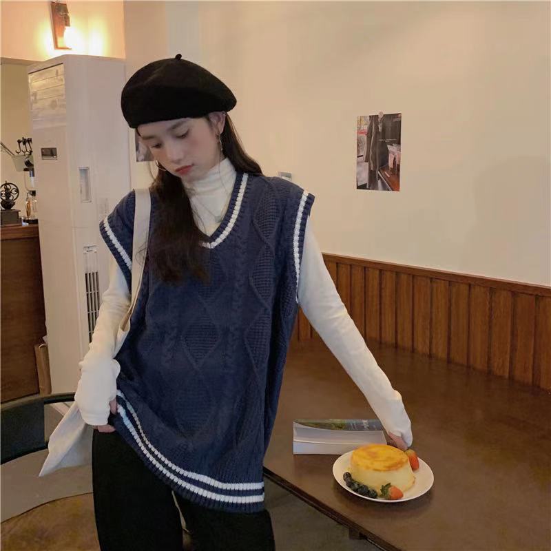 Áo IELGY đan dáng rộng phối màu xanh dương cổ chữ V dành cho nữ