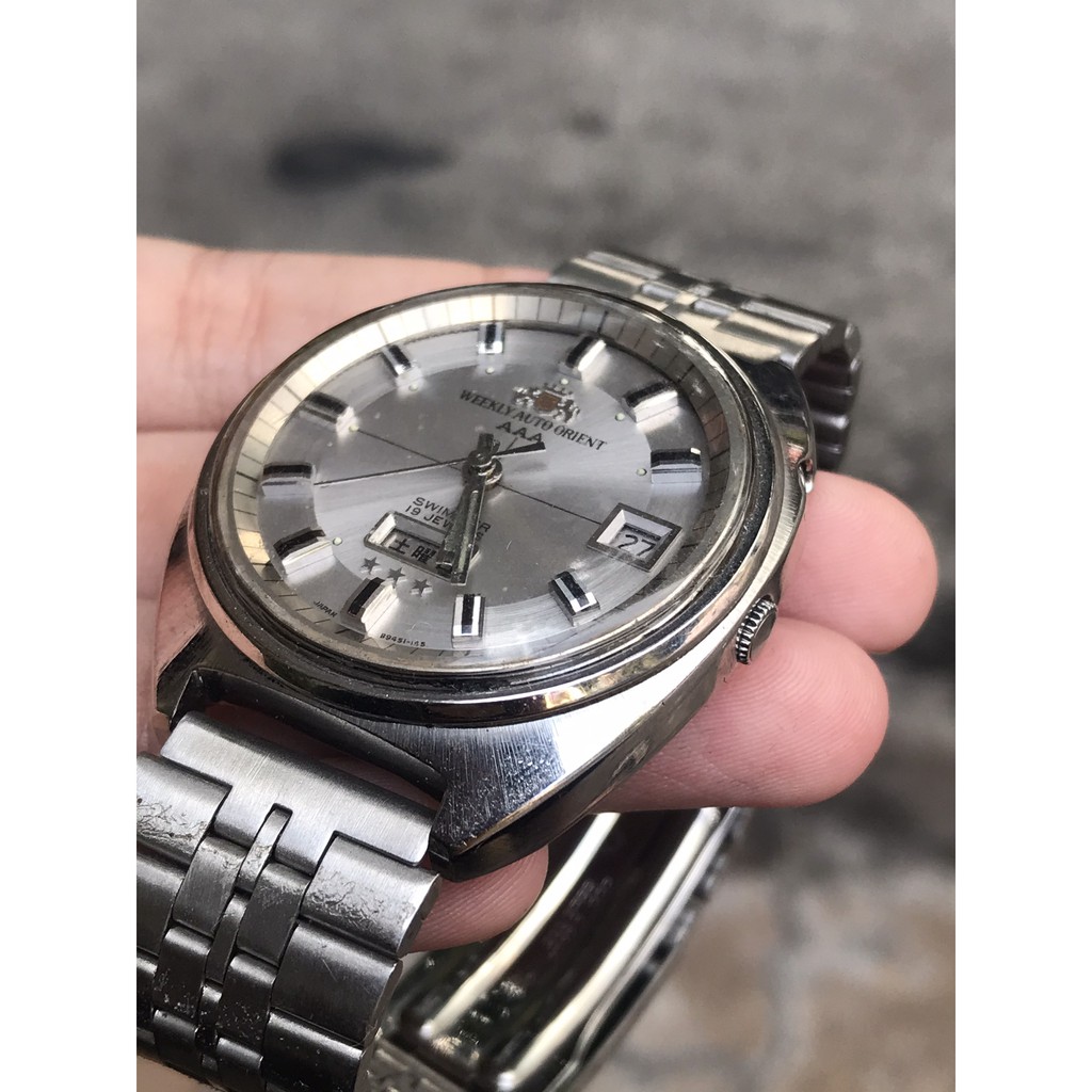 Đồng hồ nam WEEKLY AUTO ORIENT AAA cơ automatic, 19 Jewels, thiết kế mặt cười, có ô cửa lịch, dây kim loại